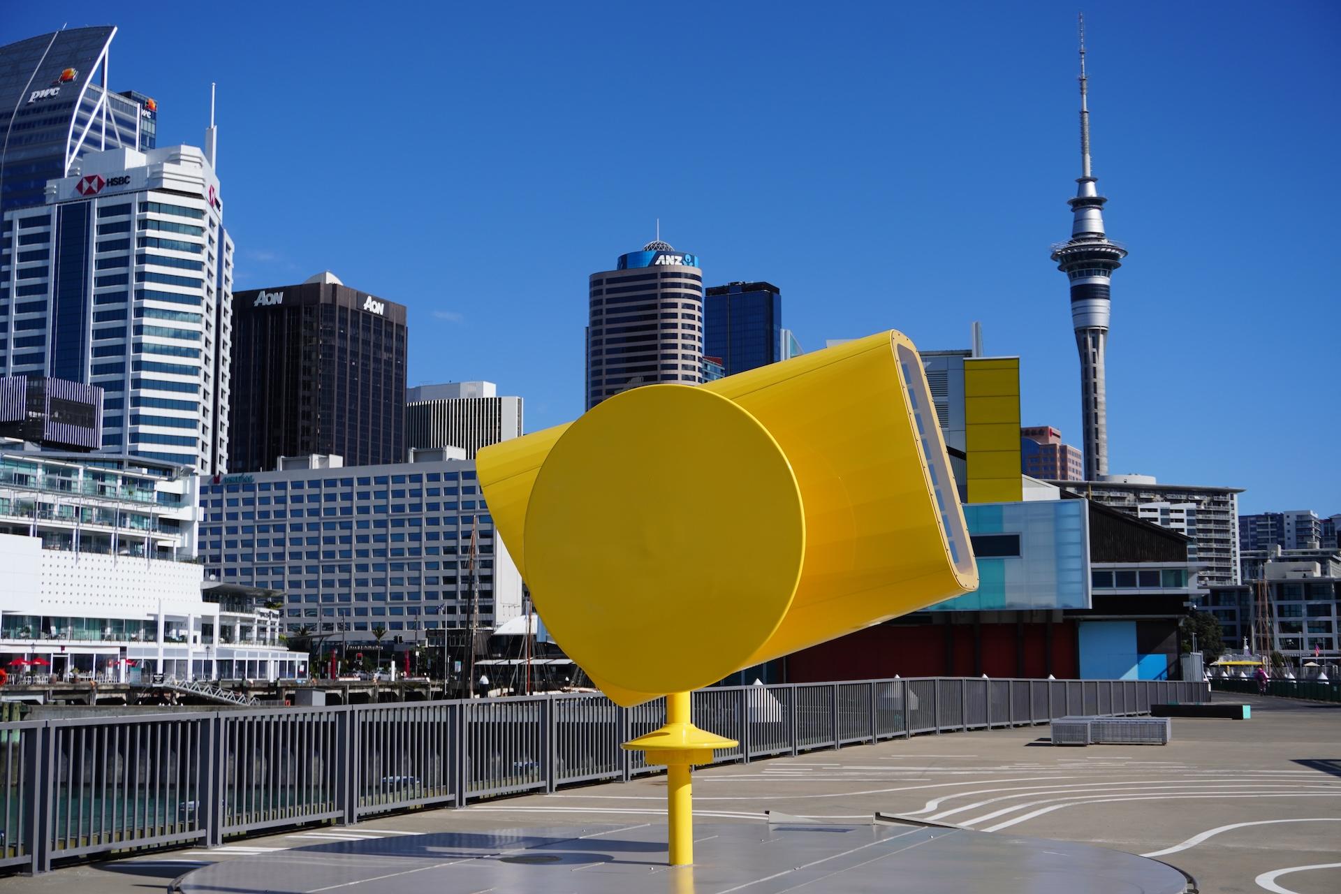 The Rainbow Machine on Hobson Wharf with high rise buildings in the background