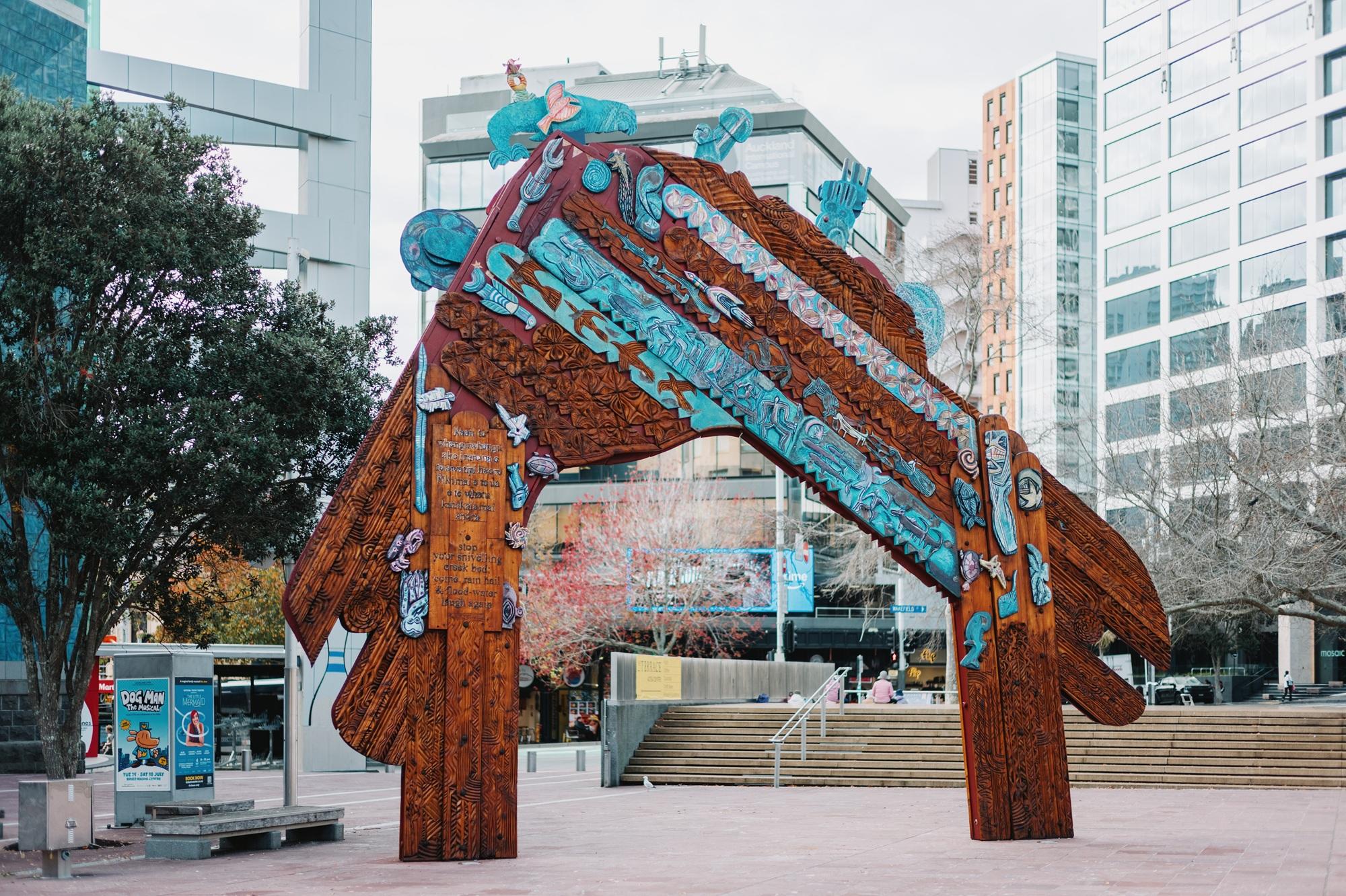 Large carved and painted wooden waharoa (gateway) in Aotea Square