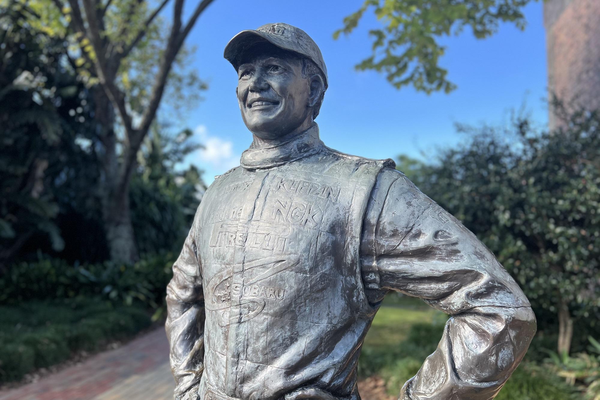 Detail view of a life size statue of Possum Bourne from the waist up